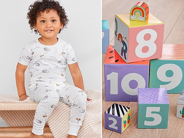 a toddler boy in a white pajama set and an image of a blocks set