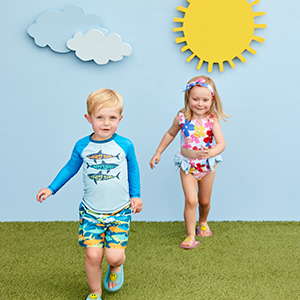 two kids running in swimwear